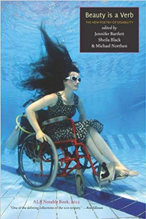 woman in a wheelchaitr at the bottom of a swimming pool