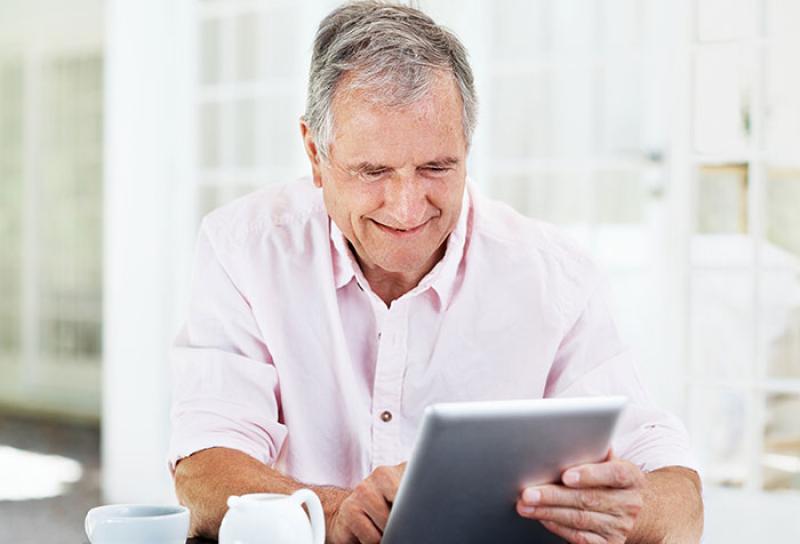 Older man using tablet