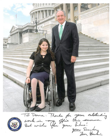 woman in wheelchair with Senator Tom Harkin on steps of U.S. capitol