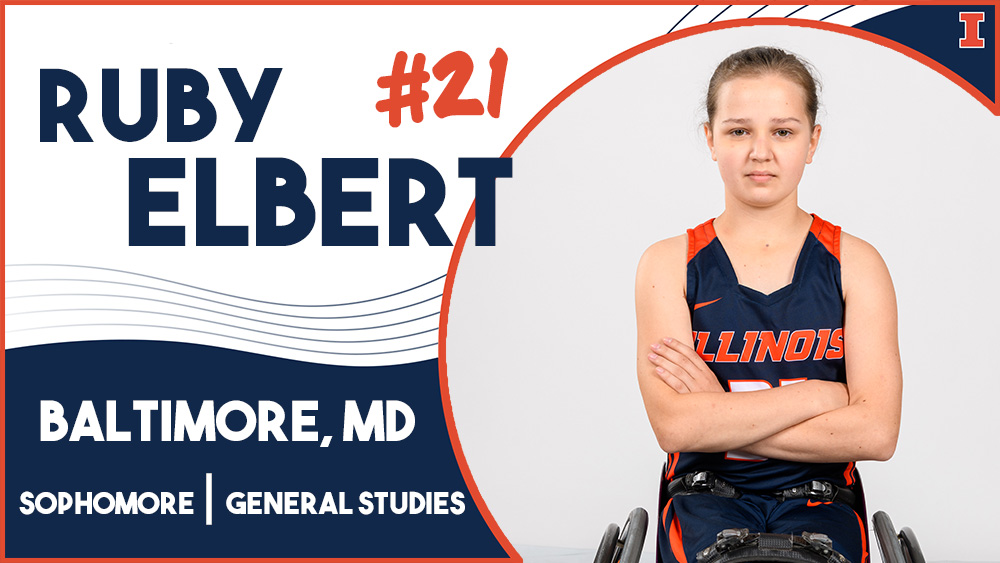 woman in Illinois basketball uniform in wheelchair crossing her arms, with text reading Ruby Elbert, #21, Baltimore, MD, Sophomore, general studies